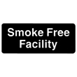 C.R. Mfg Sign: SMOKE FREE FACILITY. Black with White Imprint, 3" x 9"